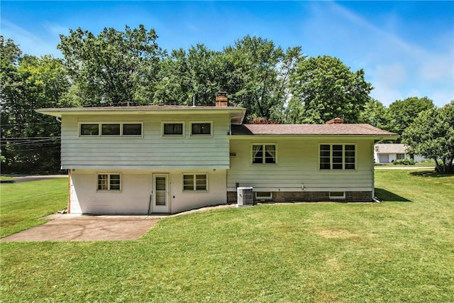 469 Koonce Rd, Hermitage, PA 16148 - back of property featuring a chimney, a yard, and a patio
