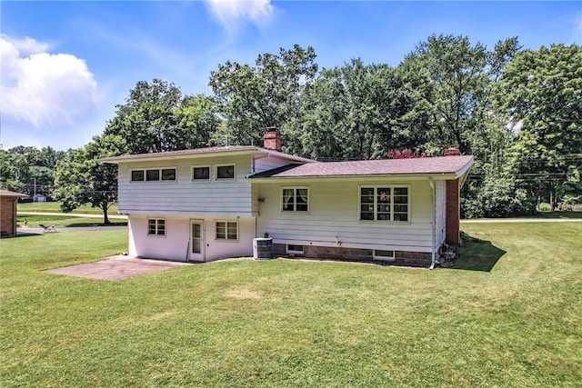 469 Koonce Rd, Hermitage, PA 16148 - rear view of house featuring a chimney, a lawn, a patio, and view of scattered trees