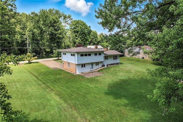 469 Koonce Rd, Hermitage, PA 16148 - back of property featuring a lawn, a patio area, and a chimney