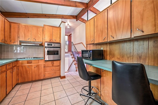 469 Koonce Rd, Hermitage, PA 16148 - kitchen with oven, black microwave, under cabinet range hood, backsplash, and brown cabinetry