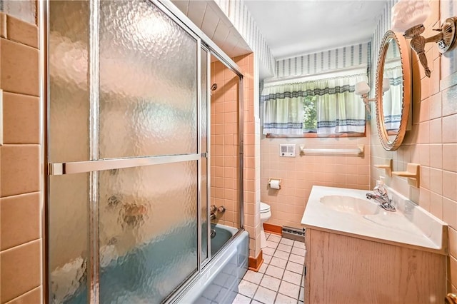 469 Koonce Rd, Hermitage, PA 16148 - bathroom featuring tile patterned flooring, tile walls, vanity, and enclosed tub / shower combo
