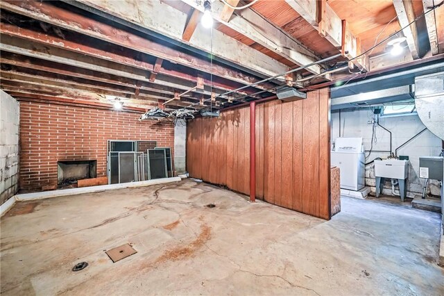 469 Koonce Rd, Hermitage, PA 16148 - unfinished below grade area featuring washer / dryer and a brick fireplace