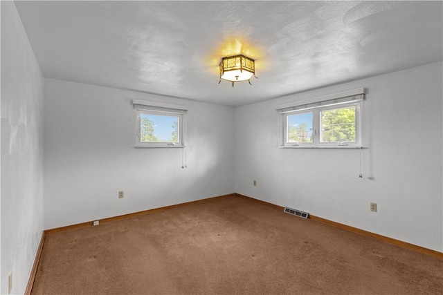 719 12th St, Pitcairn, PA 15140 - carpeted empty room featuring plenty of natural light