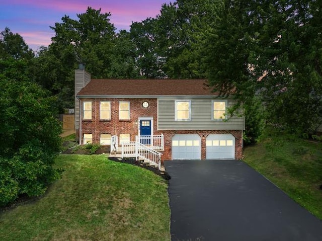 3415 Cedar Glen Dr, West Deer, PA 15101 - bi-level home with a garage, driveway, a chimney, brick siding, and a front lawn