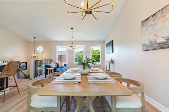 3415 Cedar Glen Dr, West Deer, PA 15101 - dining room featuring a chandelier, light wood-style floors, and lofted ceiling