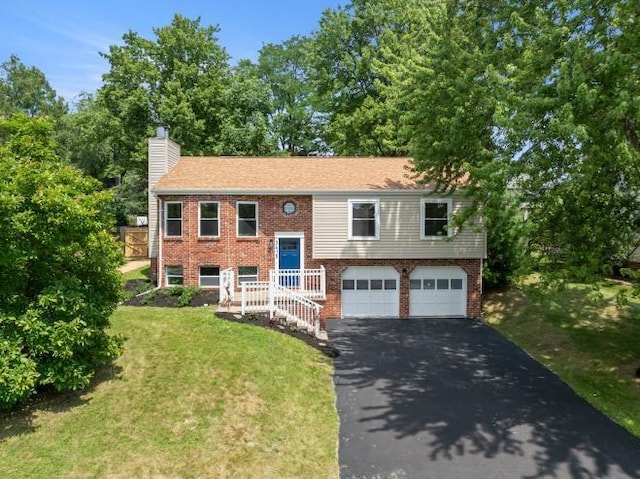3415 Cedar Glen Dr, West Deer, PA 15101 - raised ranch featuring driveway, a garage, a chimney, brick siding, and a front lawn
