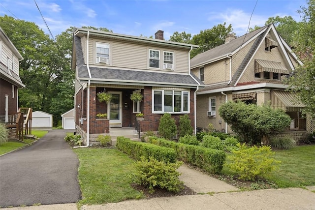 210 Ridge Ave, Ben Avon, PA 15202 - view of front facade featuring a chimney, an outdoor structure, brick siding, cooling unit, and roof with shingles