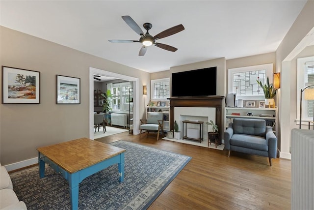210 Ridge Ave, Ben Avon, PA 15202 - living room featuring radiator heating unit, a ceiling fan, and wood finished floors