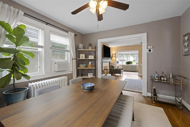 210 Ridge Ave, Ben Avon, PA 15202 - dining area featuring radiator, ceiling fan, and wood finished floors