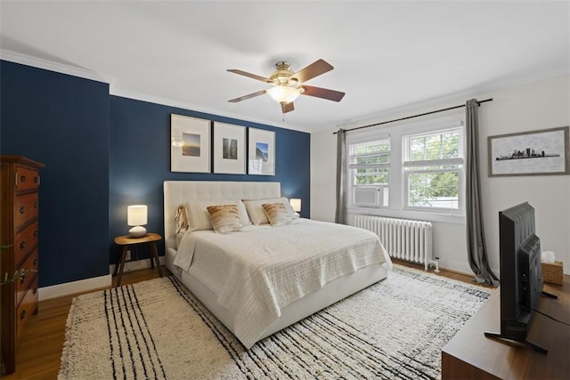 210 Ridge Ave, Ben Avon, PA 15202 - bedroom featuring radiator, wood finished floors, ornamental molding, and ceiling fan