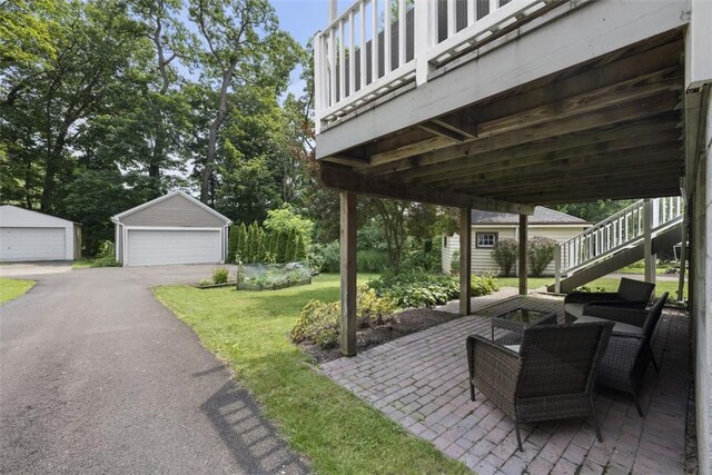 210 Ridge Ave, Ben Avon, PA 15202 - view of patio / terrace with stairway, a detached garage, and a storage shed