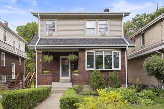 210 Ridge Ave, Ben Avon, PA 15202 - view of front facade featuring brick siding, a chimney, roof with shingles, and stairway
