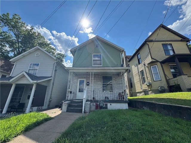 612 Pearson St, New Castle, PA 16101 - view of front of home featuring a porch, stone siding, and a front yard