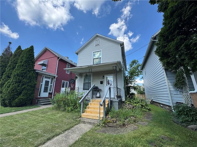 1229 Huron Ave, New Castle, PA 16101 - view of front of home featuring a front lawn and covered porch