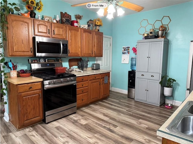 811 Cleveland Ave, Brackenridge, PA 15014 - kitchen with appliances with stainless steel finishes, ceiling fan, light wood-type flooring, and light countertops