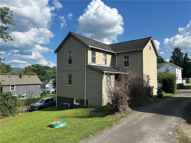 25 E Craig St, Uniontown, PA 15401 - view of side of property with a yard and a central AC unit