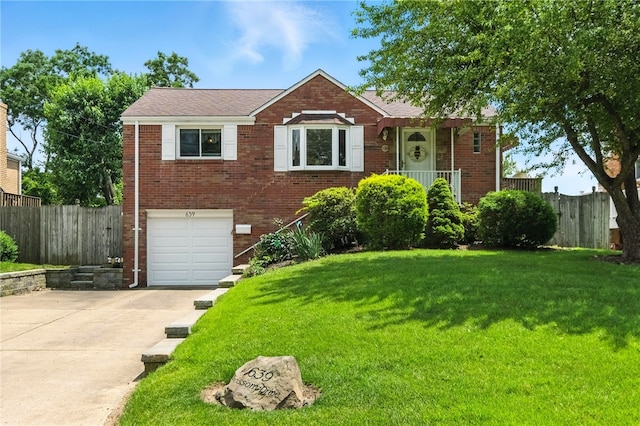 639 Blossom Dr, Baldwin Boro, PA 15236 - view of front of property featuring an attached garage, brick siding, and concrete driveway