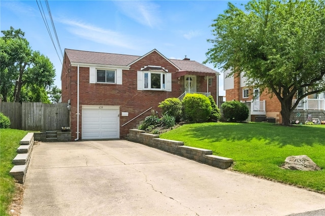 639 Blossom Dr, Baldwin Boro, PA 15236 - view of front of house with brick siding, concrete driveway, and an attached garage