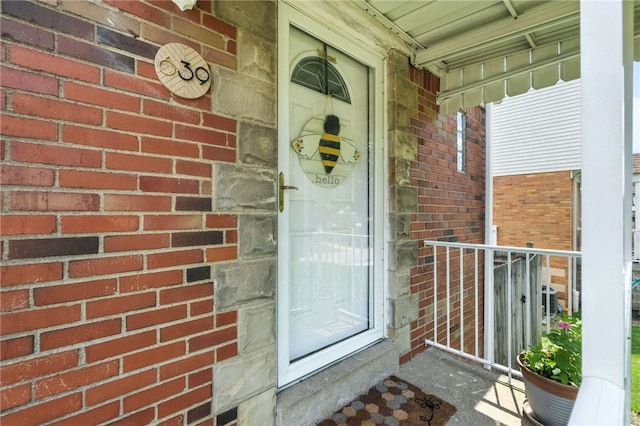 639 Blossom Dr, Baldwin Boro, PA 15236 - doorway to property with brick siding and covered porch