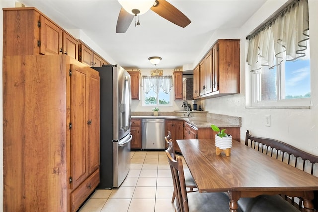 639 Blossom Dr, Baldwin Boro, PA 15236 - kitchen featuring stainless steel appliances, brown cabinets, ceiling fan, and light countertops