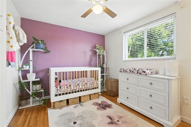 639 Blossom Dr, Baldwin Boro, PA 15236 - bedroom with light wood-style floors and a crib