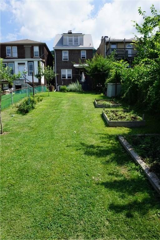 2430 Woodstock Ave, Swissvale, PA 15218 - view of green lawn with a vegetable garden