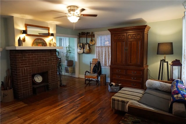 2430 Woodstock Ave, Swissvale, PA 15218 - living room with a brick fireplace, ceiling fan, and dark wood-style floors