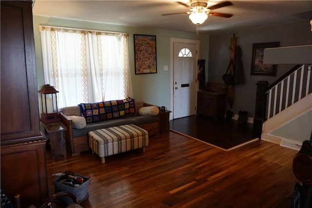 2430 Woodstock Ave, Swissvale, PA 15218 - living area featuring ceiling fan, healthy amount of natural light, wood finished floors, and stairway