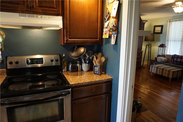 2430 Woodstock Ave, Swissvale, PA 15218 - kitchen featuring stainless steel range with electric cooktop, under cabinet range hood, wood finished floors, open floor plan, and a ceiling fan