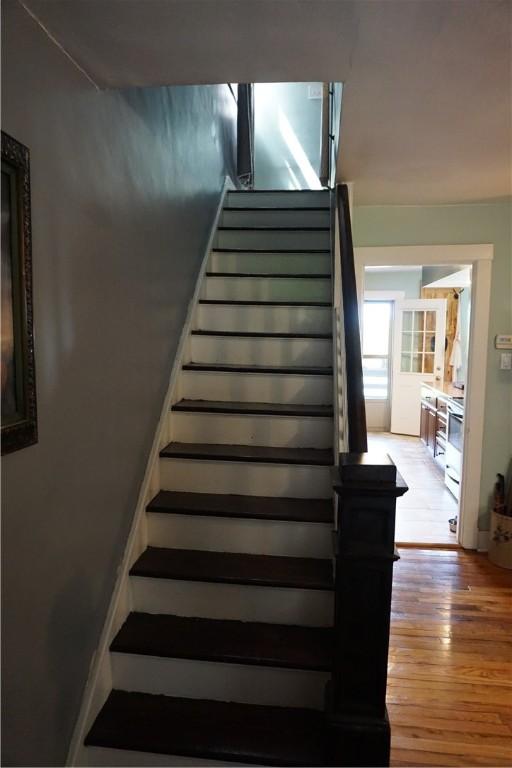 2430 Woodstock Ave, Swissvale, PA 15218 - stairs with hardwood / wood-style floors