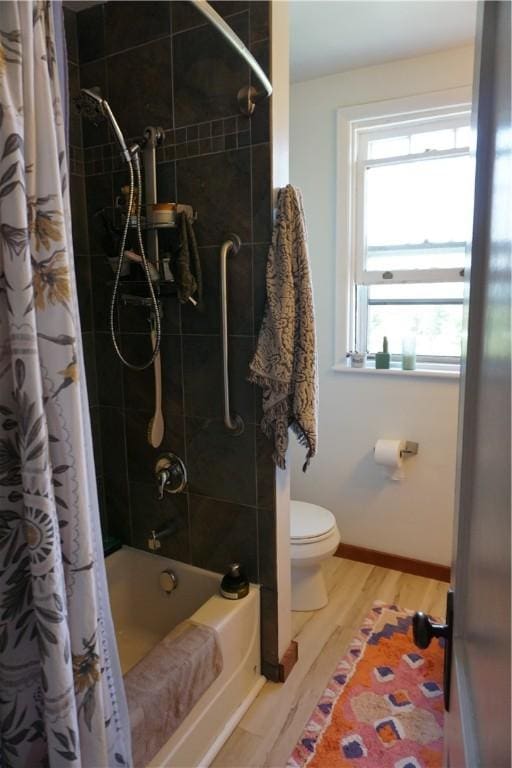 2430 Woodstock Ave, Swissvale, PA 15218 - full bath with wood finished floors and shower / bathtub combination with curtain