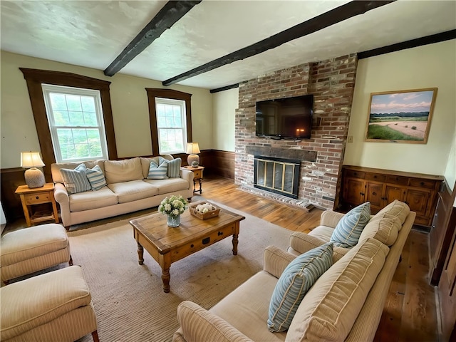 328 Thatcher Rd, Fairfield Twp, PA 15944 - living room featuring hardwood / wood-style flooring, beamed ceiling, wainscoting, and a fireplace