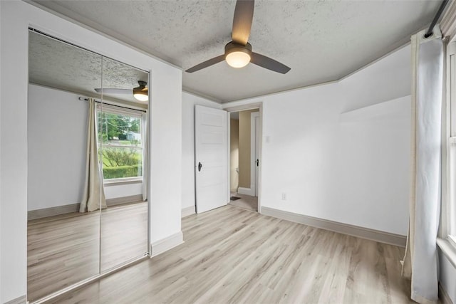 102 Clarks Ln, Adams Twp, PA 16046 - unfurnished bedroom with wood finished floors, a textured ceiling, and ceiling fan