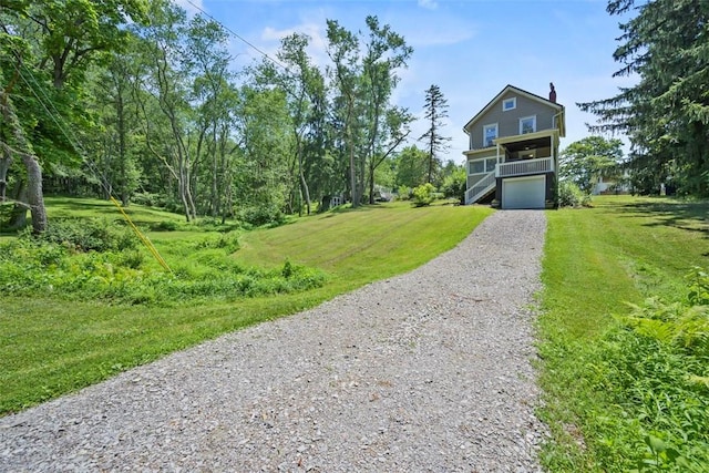 102 Clarks Ln, Adams Twp, PA 16046 - view of front facade featuring gravel driveway, a front yard, stairs, and an attached garage
