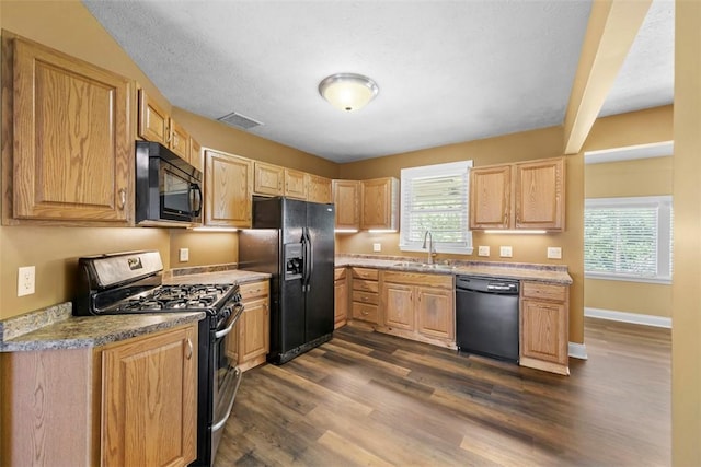 102 Clarks Ln, Adams Twp, PA 16046 - kitchen with black appliances, dark wood-style floors, plenty of natural light, and light brown cabinets