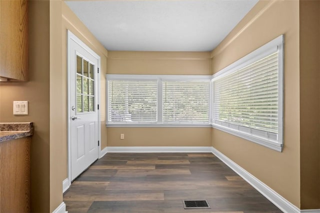 102 Clarks Ln, Adams Twp, PA 16046 - doorway to outside featuring baseboards and dark wood-style floors