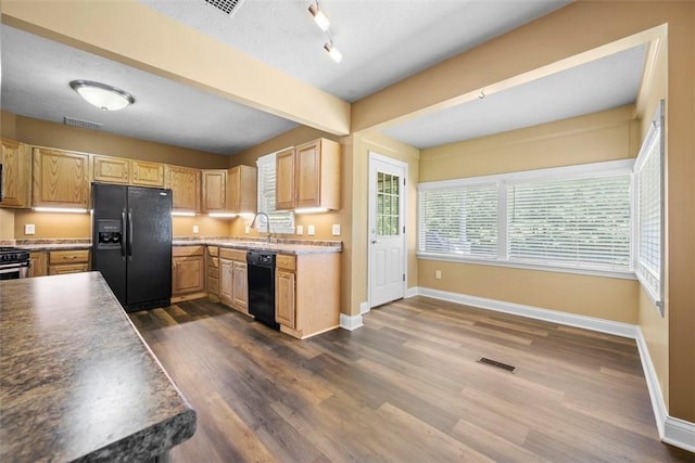 102 Clarks Ln, Adams Twp, PA 16046 - kitchen with black appliances, dark wood-style flooring, light brown cabinets, beam ceiling, and track lighting