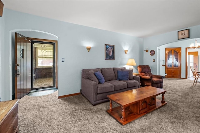 8 Harmar Dr, Cheswick, PA 15024 - carpeted living room with arched walkways and a chandelier