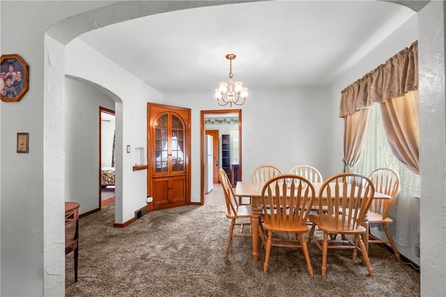 8 Harmar Dr, Cheswick, PA 15024 - carpeted dining area with arched walkways and a chandelier
