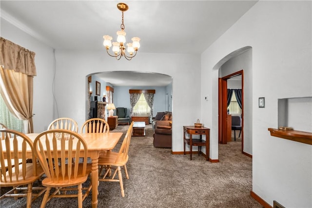 8 Harmar Dr, Cheswick, PA 15024 - dining area featuring arched walkways, a chandelier, and carpet floors