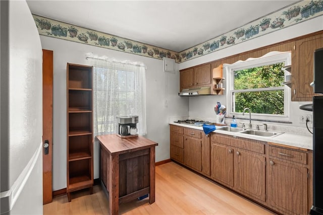8 Harmar Dr, Cheswick, PA 15024 - kitchen featuring open shelves, light wood finished floors, stainless steel gas cooktop, brown cabinets, and under cabinet range hood
