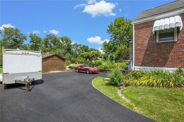 8 Harmar Dr, Cheswick, PA 15024 - view of parking with a storage shed and asphalt driveway