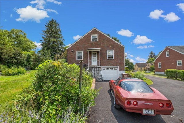 8 Harmar Dr, Cheswick, PA 15024 - view of front of house with driveway, a garage, brick siding, and a front yard
