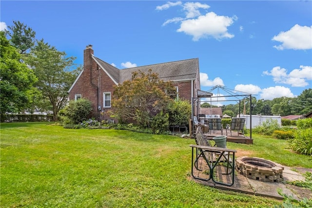 8 Harmar Dr, Cheswick, PA 15024 - rear view of property with an outdoor fire pit, a gazebo, a yard, and brick siding