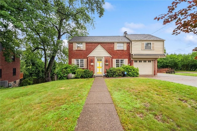 192 Glenfield Dr, Penn Hills, PA 15235 - view of front facade featuring brick siding, driveway, a front yard, and an attached garage