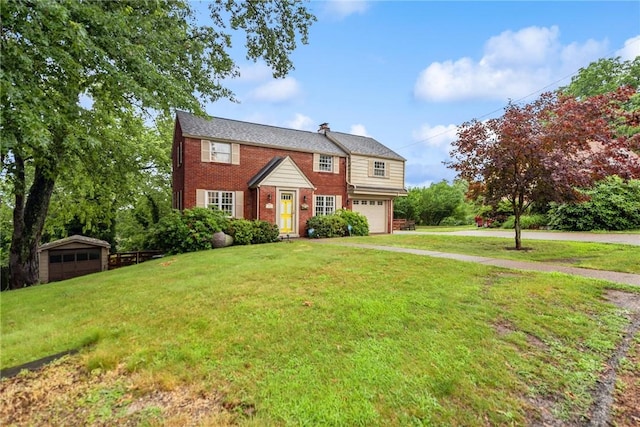 192 Glenfield Dr, Penn Hills, PA 15235 - view of front of property with brick siding, a front yard, an attached garage, and a chimney