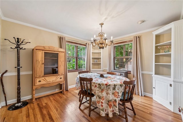 192 Glenfield Dr, Penn Hills, PA 15235 - dining space featuring a chandelier, healthy amount of natural light, light wood-style flooring, and crown molding