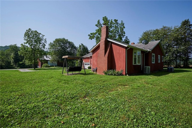 2583 State Route 210, Cowanshanock Twp, PA 16249 - view of home's exterior featuring a chimney and a lawn