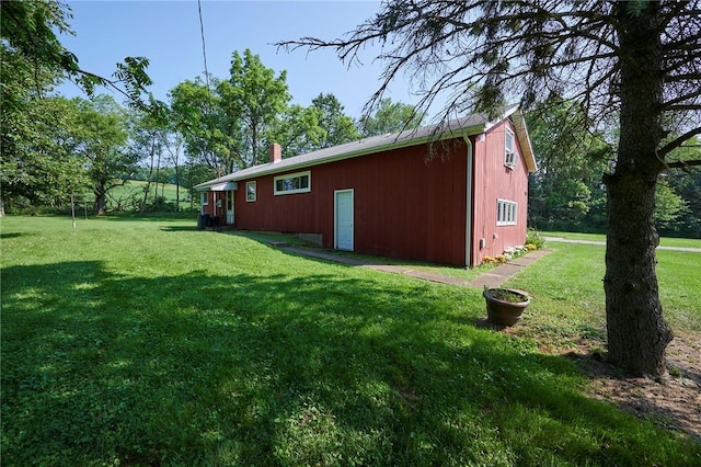 2583 State Route 210, Cowanshanock Twp, PA 16249 - view of side of home featuring a lawn, an outbuilding, and a chimney