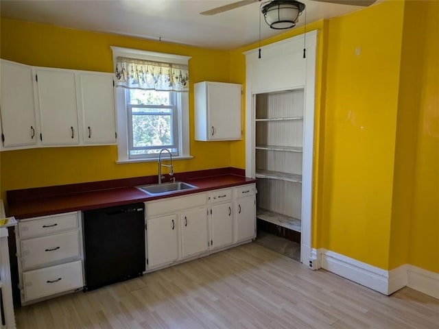 413 N 3rd St, Jeannette, PA 15644 - kitchen with dishwasher, dark countertops, light wood-type flooring, and white cabinetry